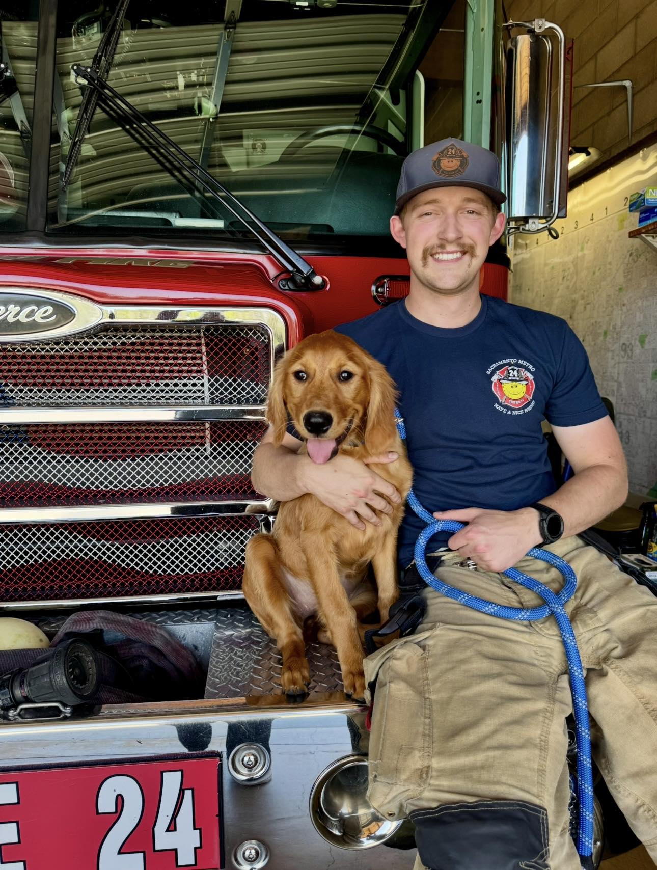 Source photo: firefighter with golden retriever